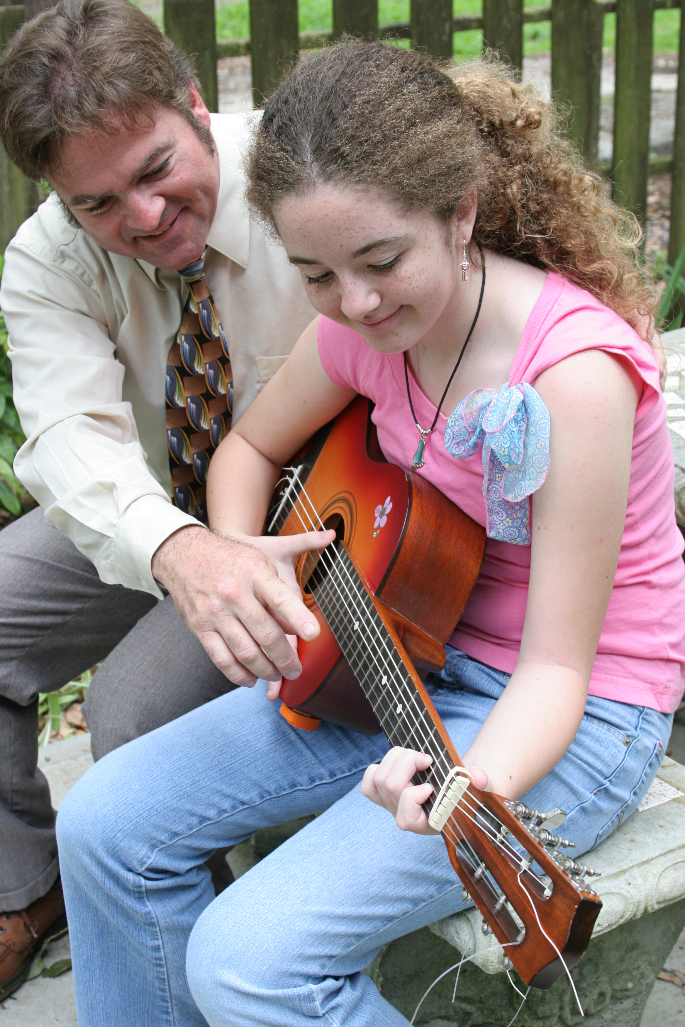 bigstockphoto_Father_Daughter_Guitar_Lesson_1_106950.jpg